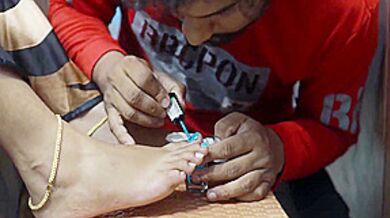 Boy Put Nail Polish On Girl Feet